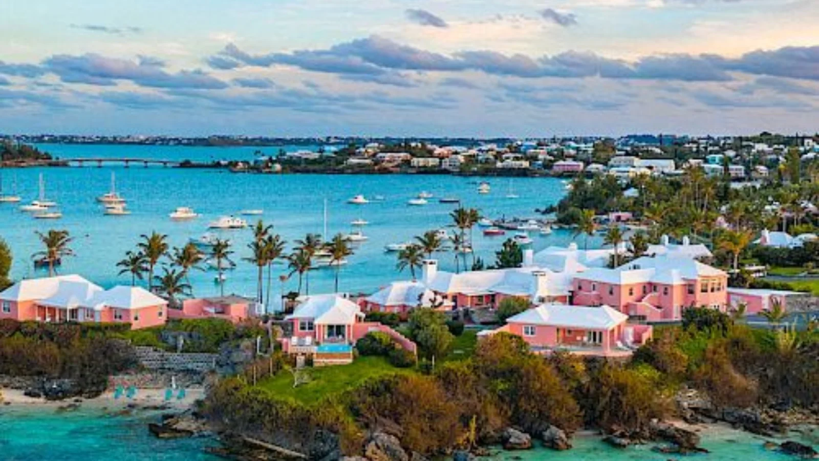 Aerial view of Bermuda coastline, turquoise water and pink island homes